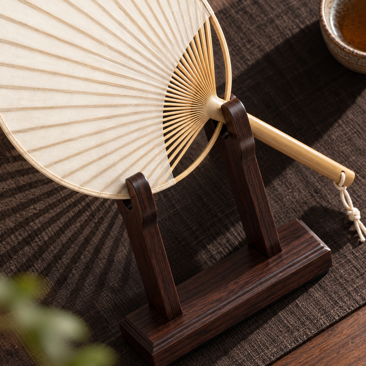 The Round Fan & Stand — Handmade Bamboo Cotton-Linen Fan with Dark Wood Display Stand