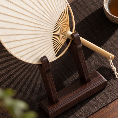 The Round Fan & Stand — Handmade Bamboo Cotton-Linen Fan with Dark Wood Display Stand
